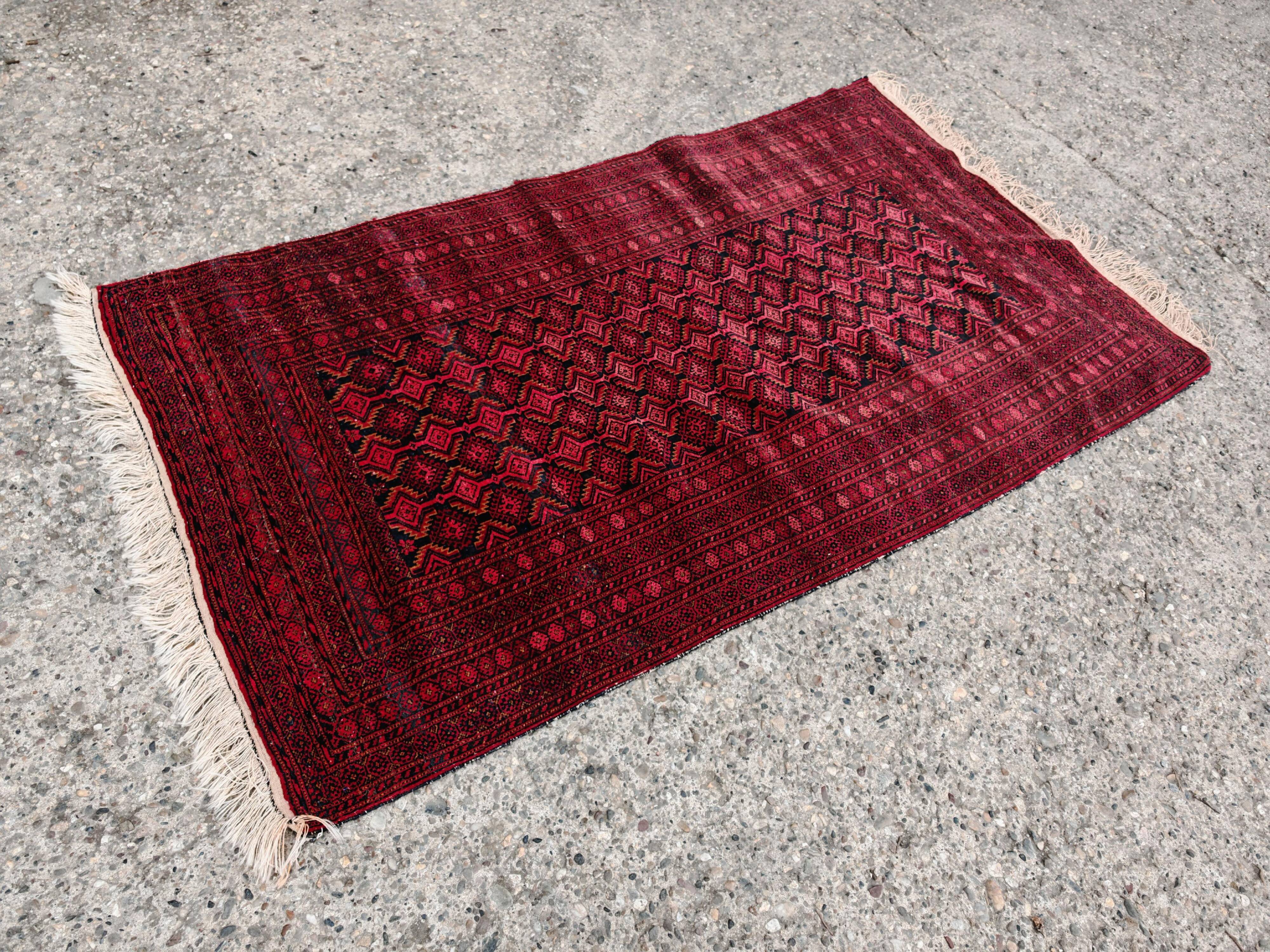 Vintage Baluch carpet handmade from natural wool, Afghanistan 1960.