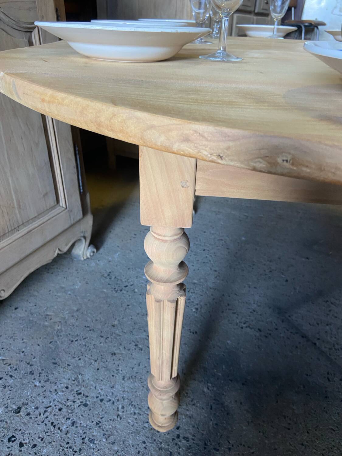 Oval wooden table on wheels.