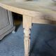 Oval wooden table on wheels.
