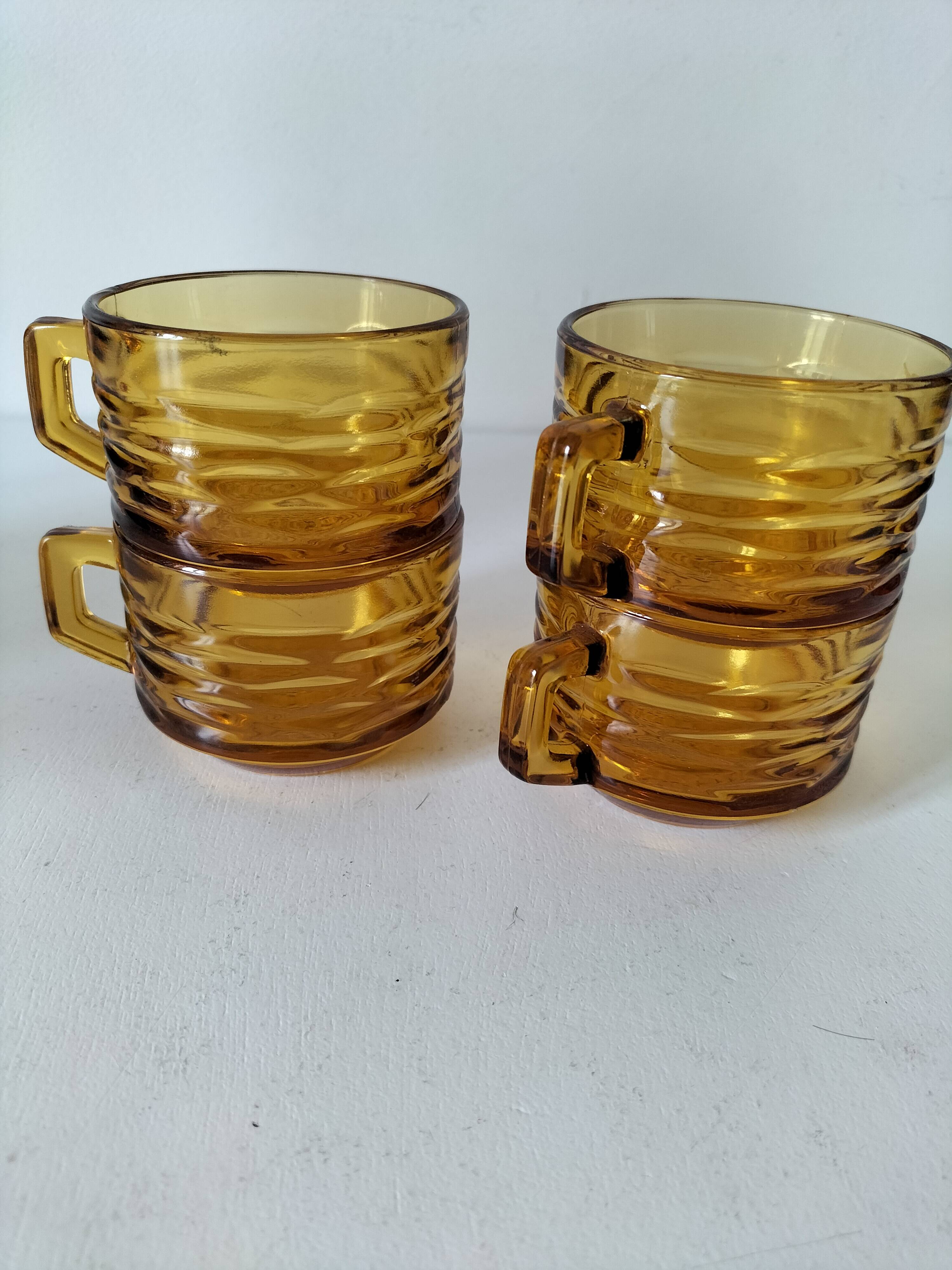 Set of 4 vintage amber glass mugs with textured 70s design