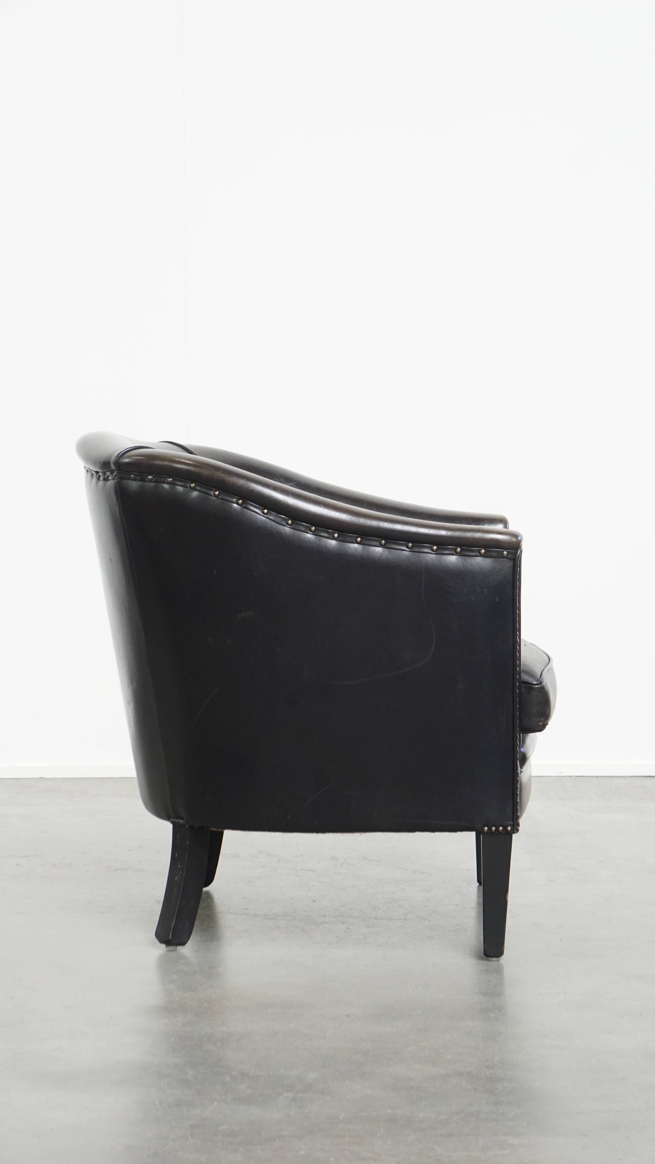Fauteuil club noir/gris en cuir de mouton