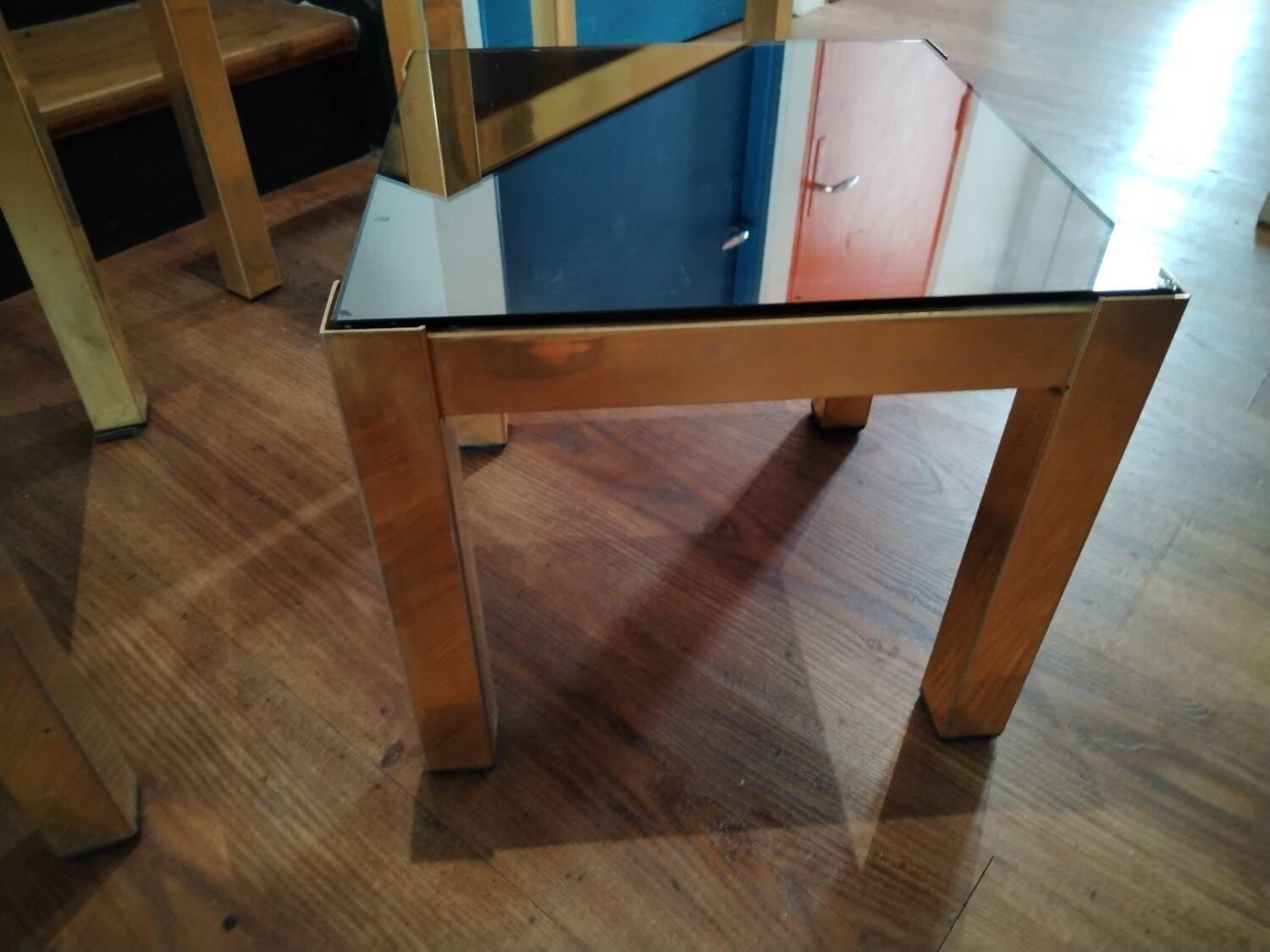 Vintage nesting table in gold metal and smoked mirror glass