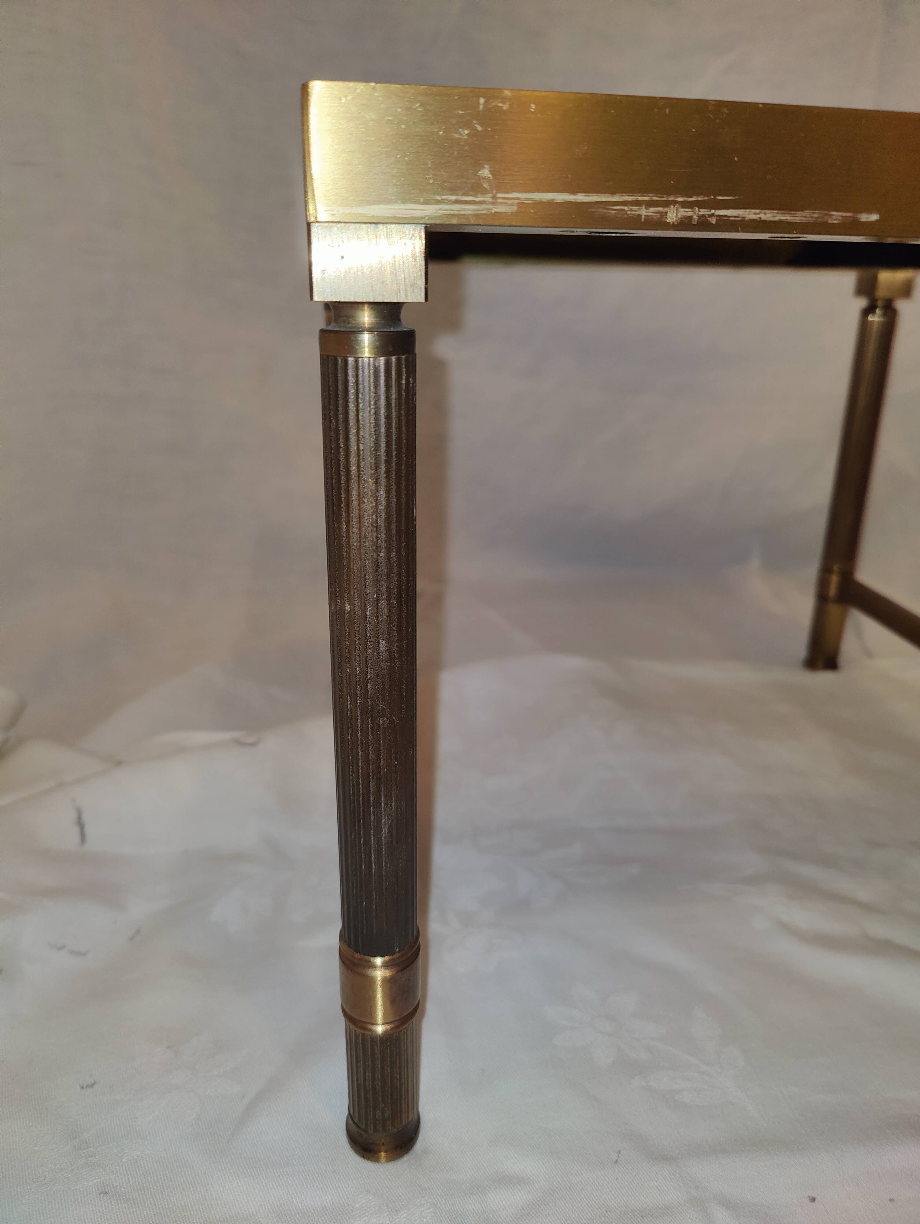 Small table or side table with brass structure and glass top from the 1970s.