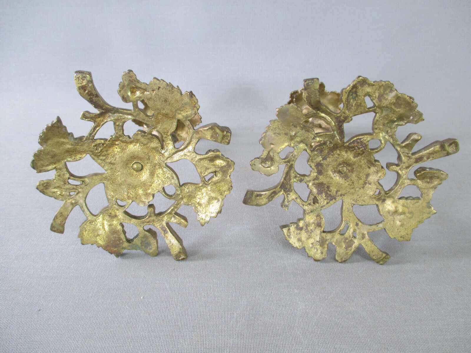 Pair of gilded bronze candlesticks with vine décor