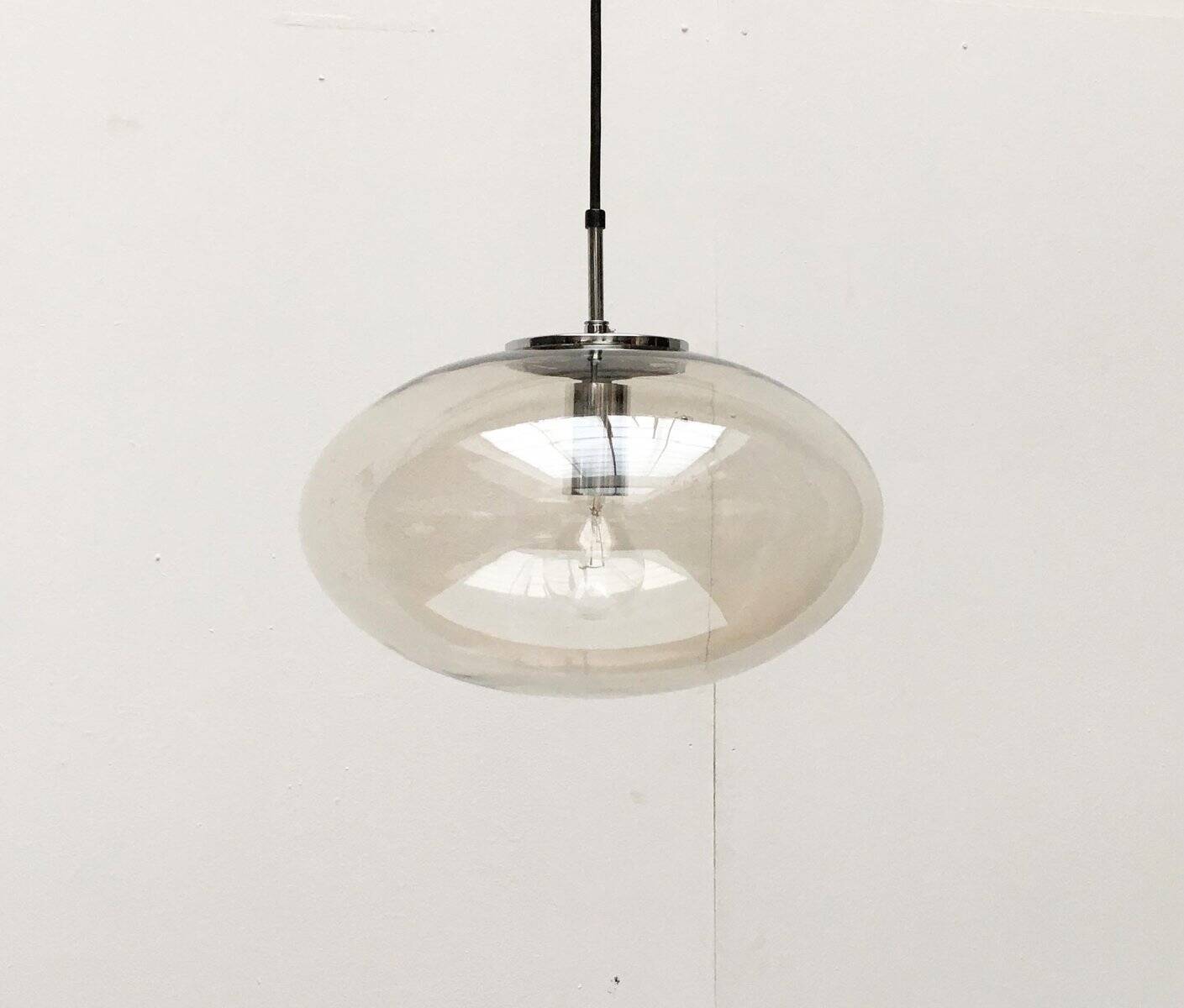 Suspended UFO-shaped glass luminaires in mid-century German Space Age style, set of 3.