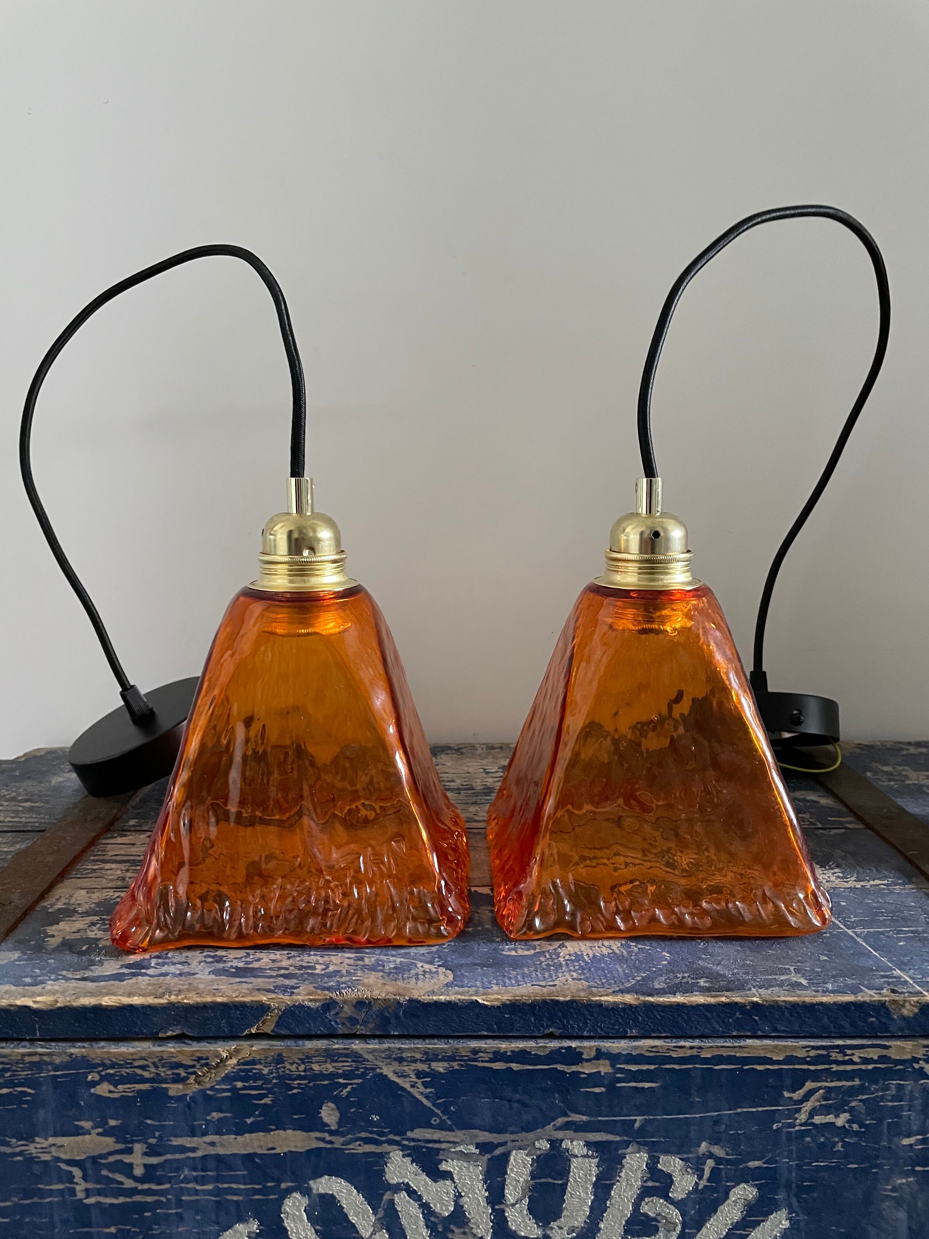 Set of two amber glass hanging lamps
