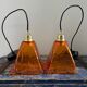 Set of two amber glass hanging lamps