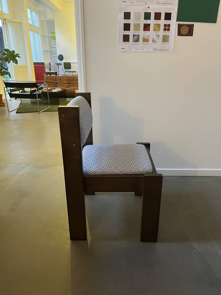 Pair of brutalist chairs in solid wood and jacquard fabric.