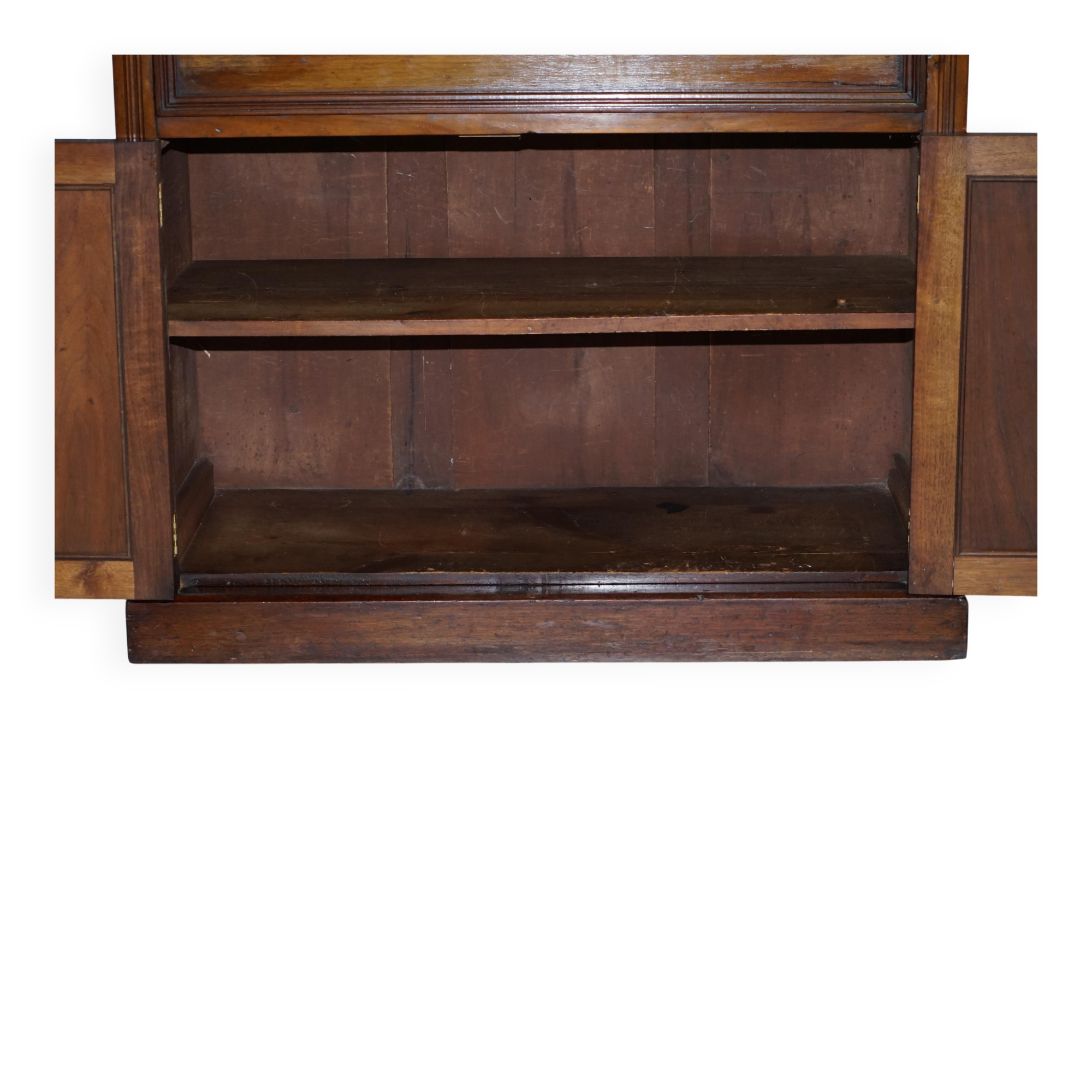 Light wood library with a secretary and leather surface.