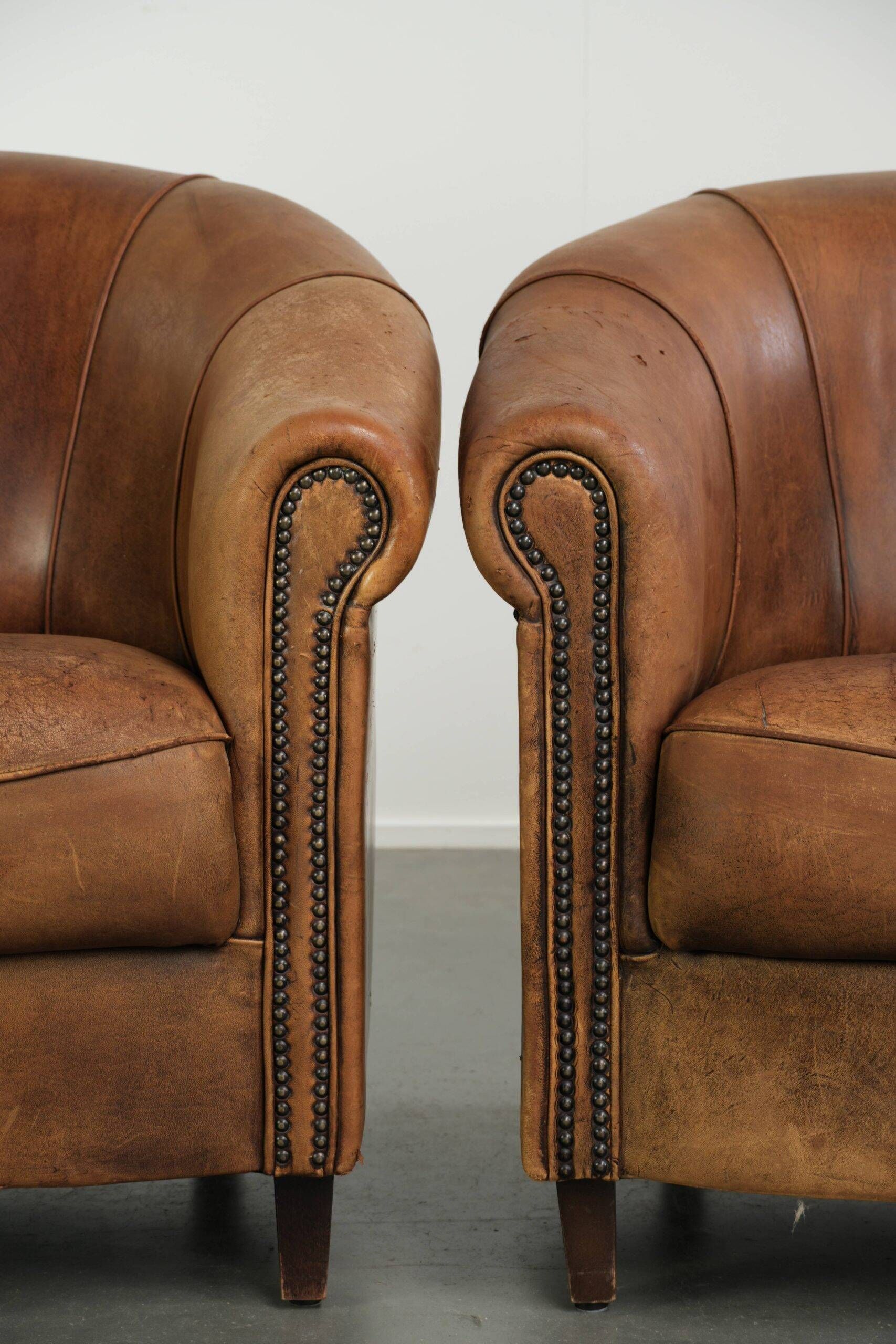 Sturdy set of vintage sheepskin club armchairs with a great appearance