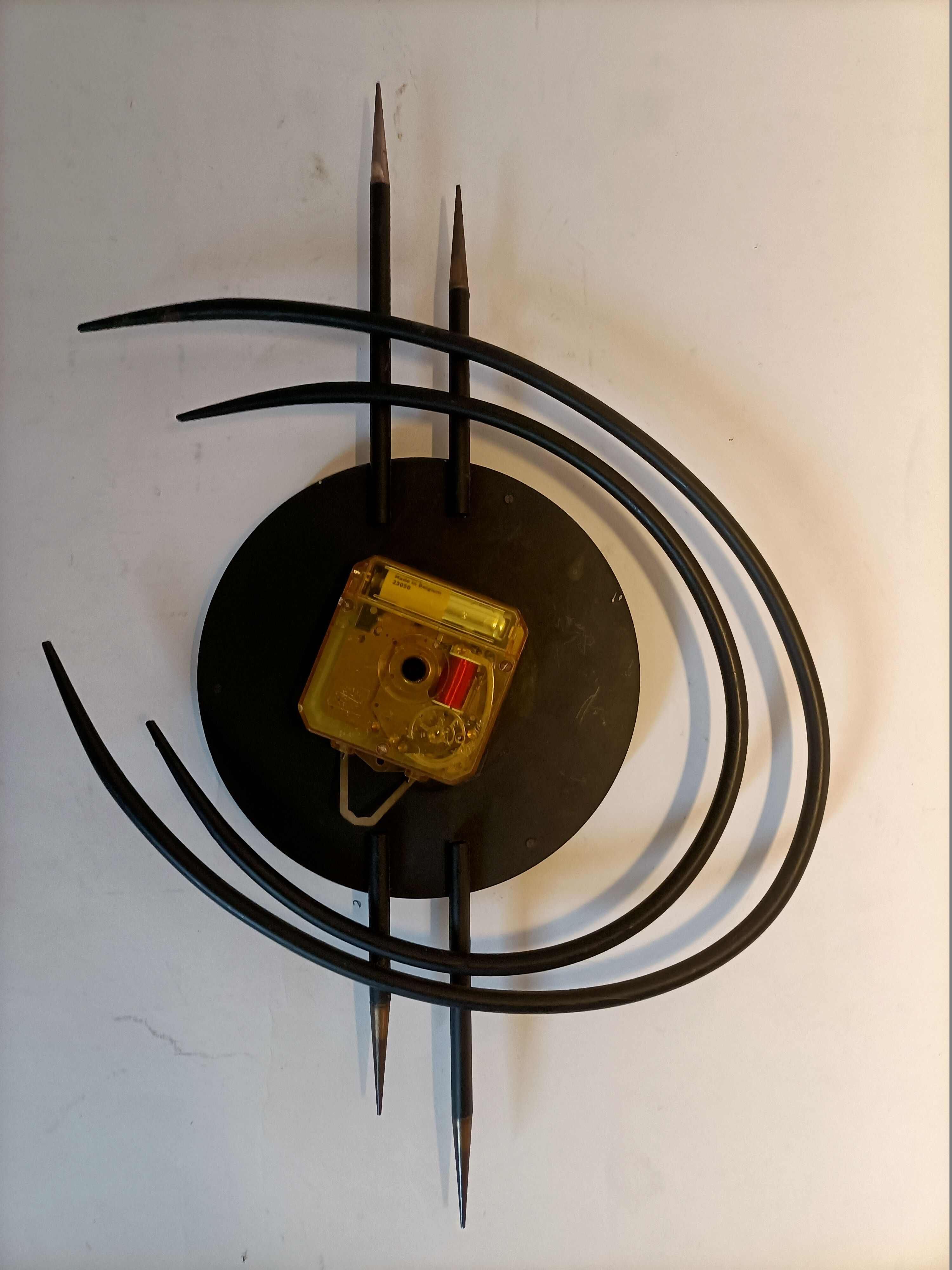 Bayard ortf wall clock in black metal and gilded brass. 1960