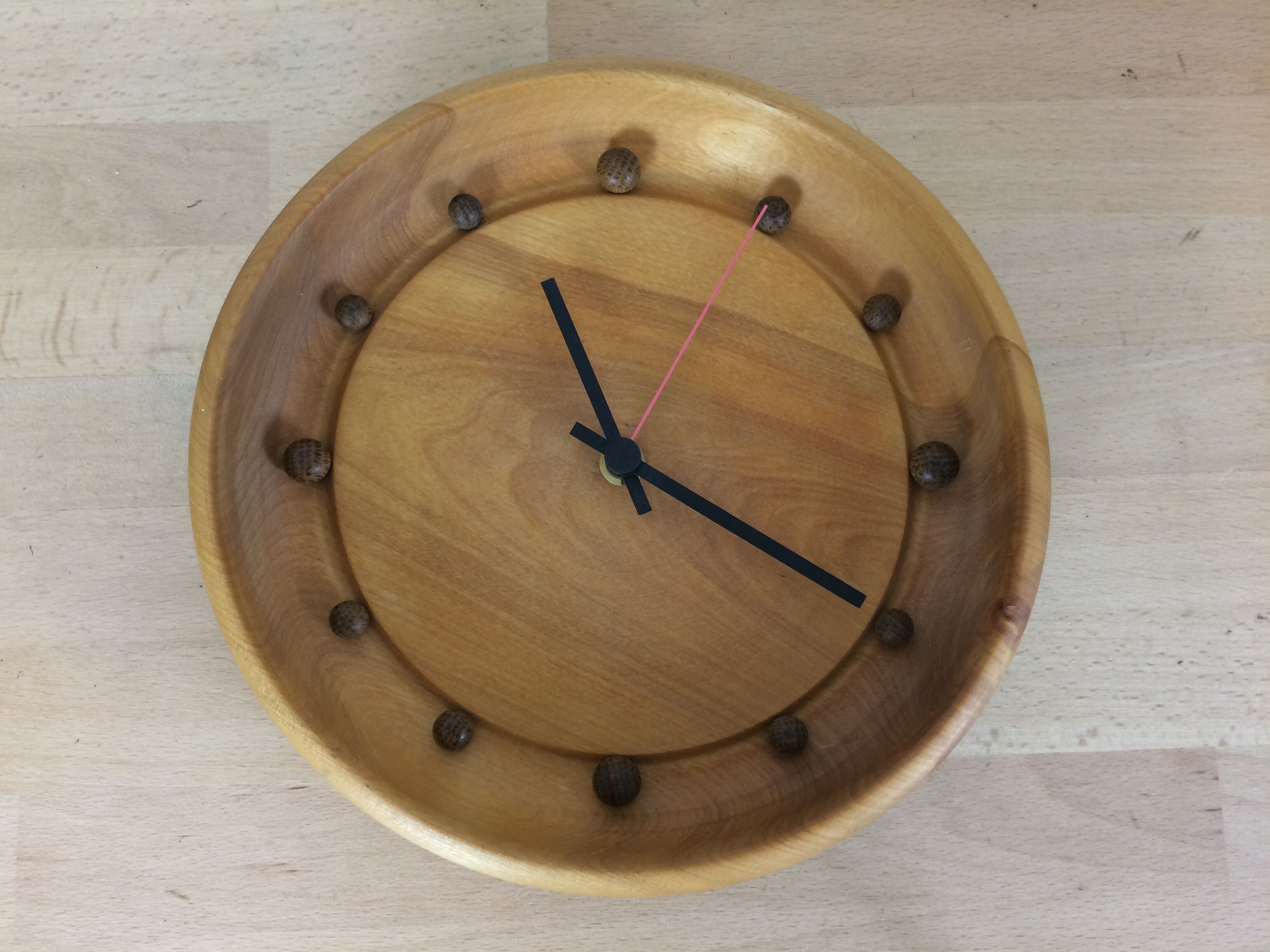 Wall clock in elm wood design