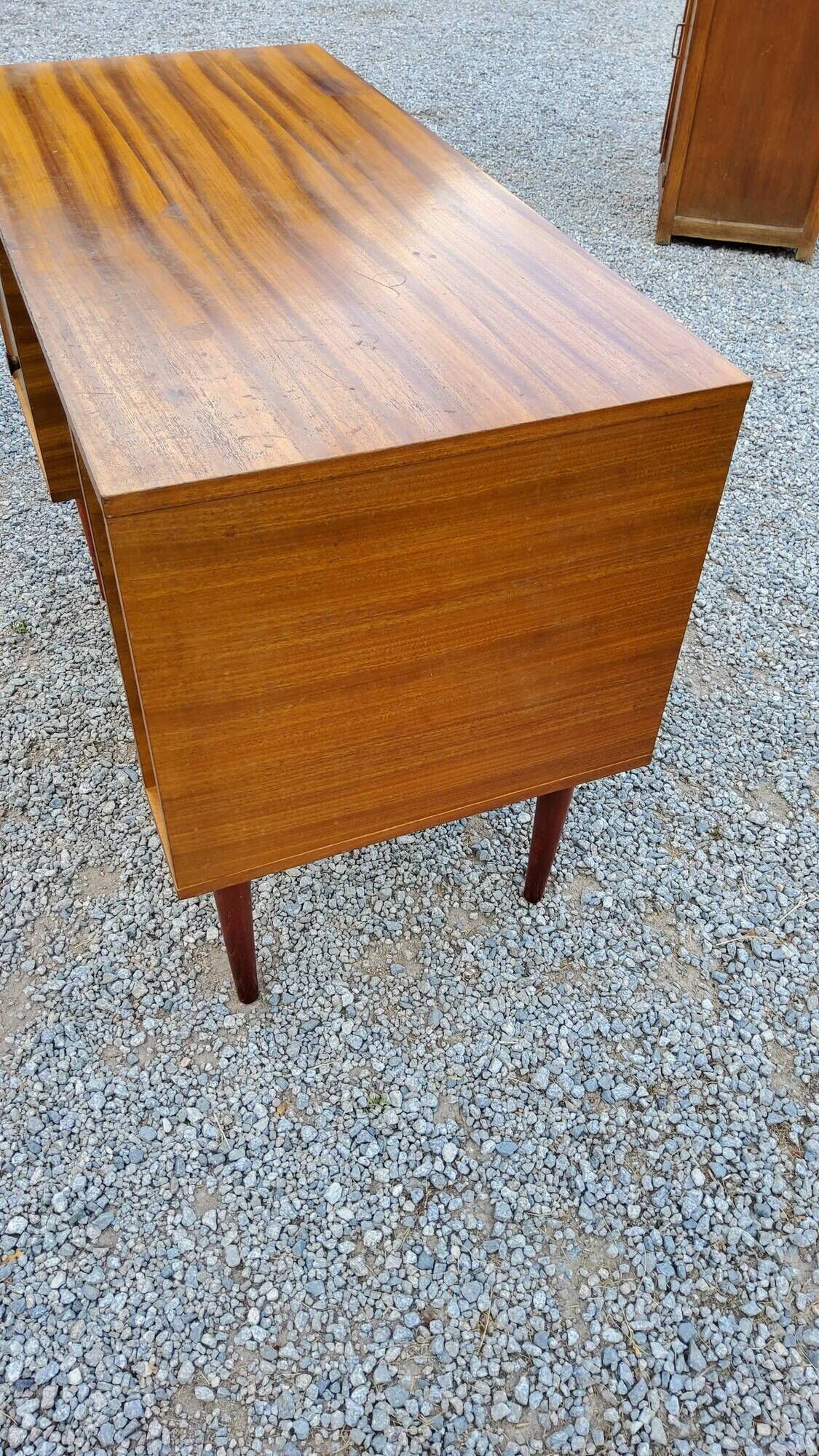 60s desk in golden blond mahogany with conical coffered feet