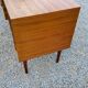 60s desk in golden blond mahogany with conical coffered feet