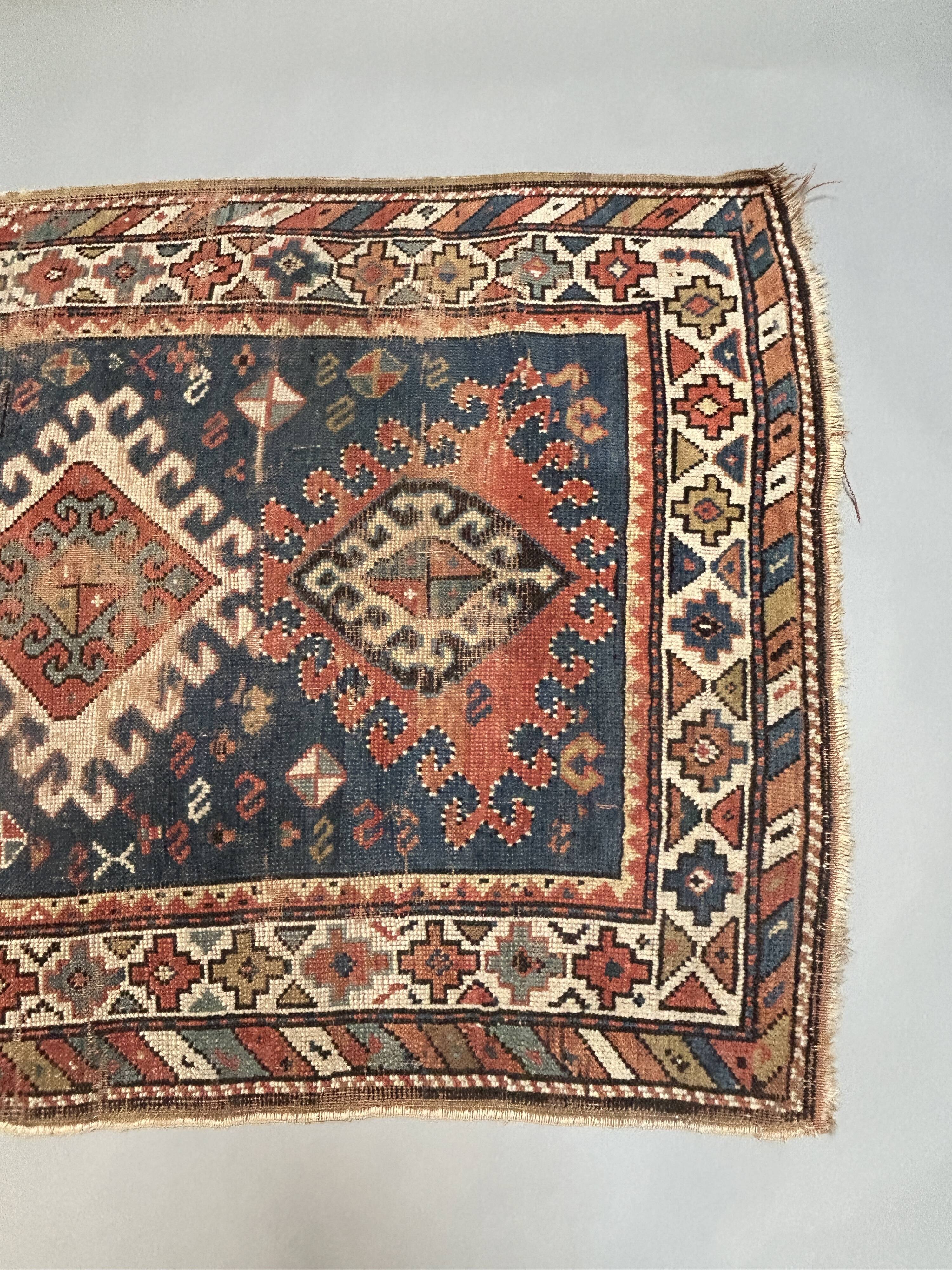 Antique kazak rug blue ground