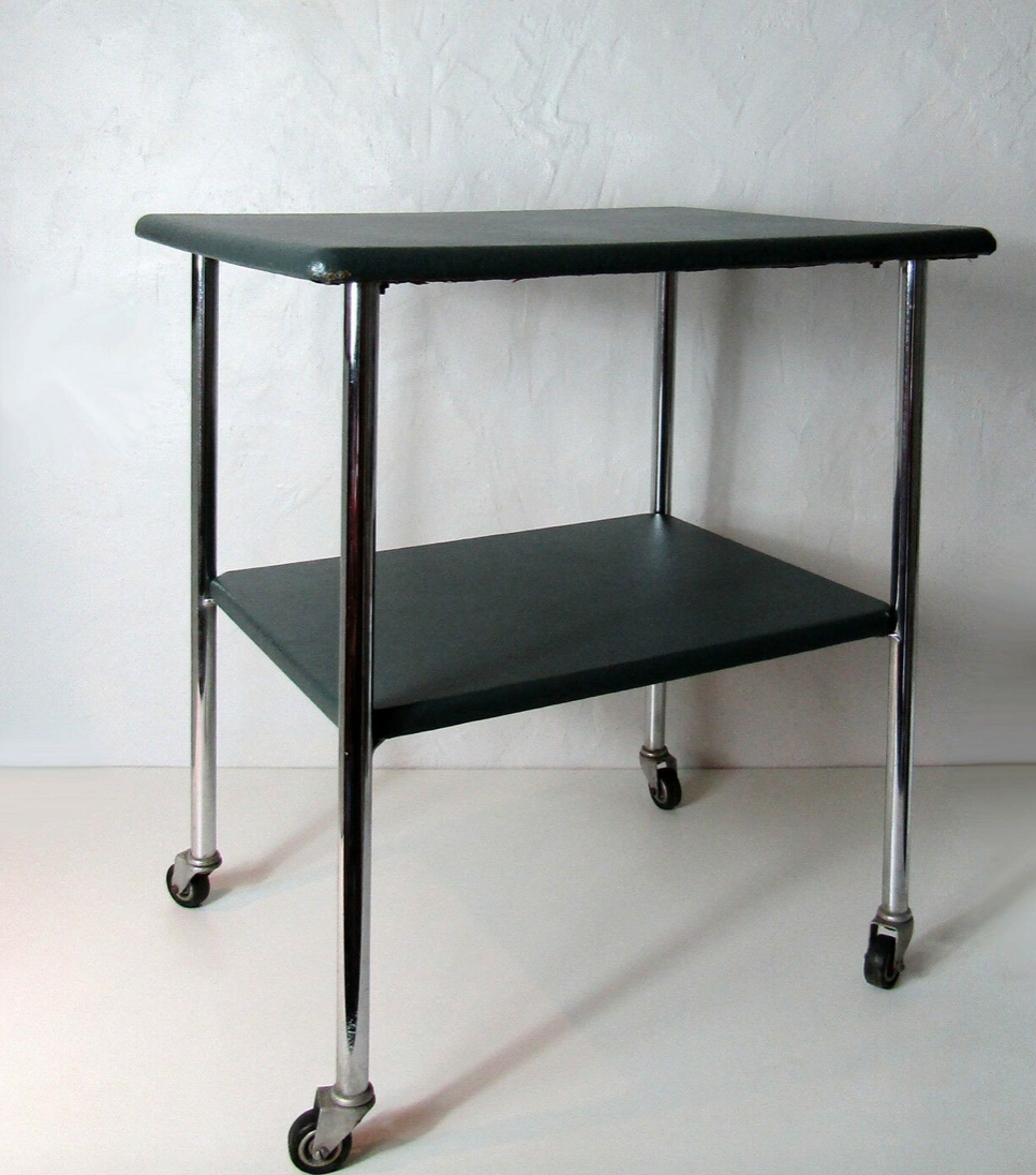 Table serves console with chrome wheels and imitation vintage khaki