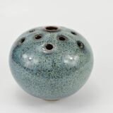 Vase with blue flowers.