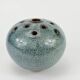 Vase with blue flowers.