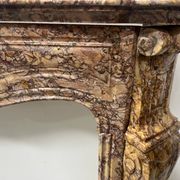 Louis XV style fireplace, Pompadour model, speckled breccia marble, 19th century
