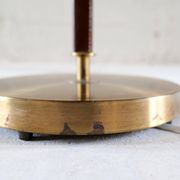 Mid-century brown leather and patinated brass floor lamp by Falkenbergs Belysning, Sweden, 1960s.