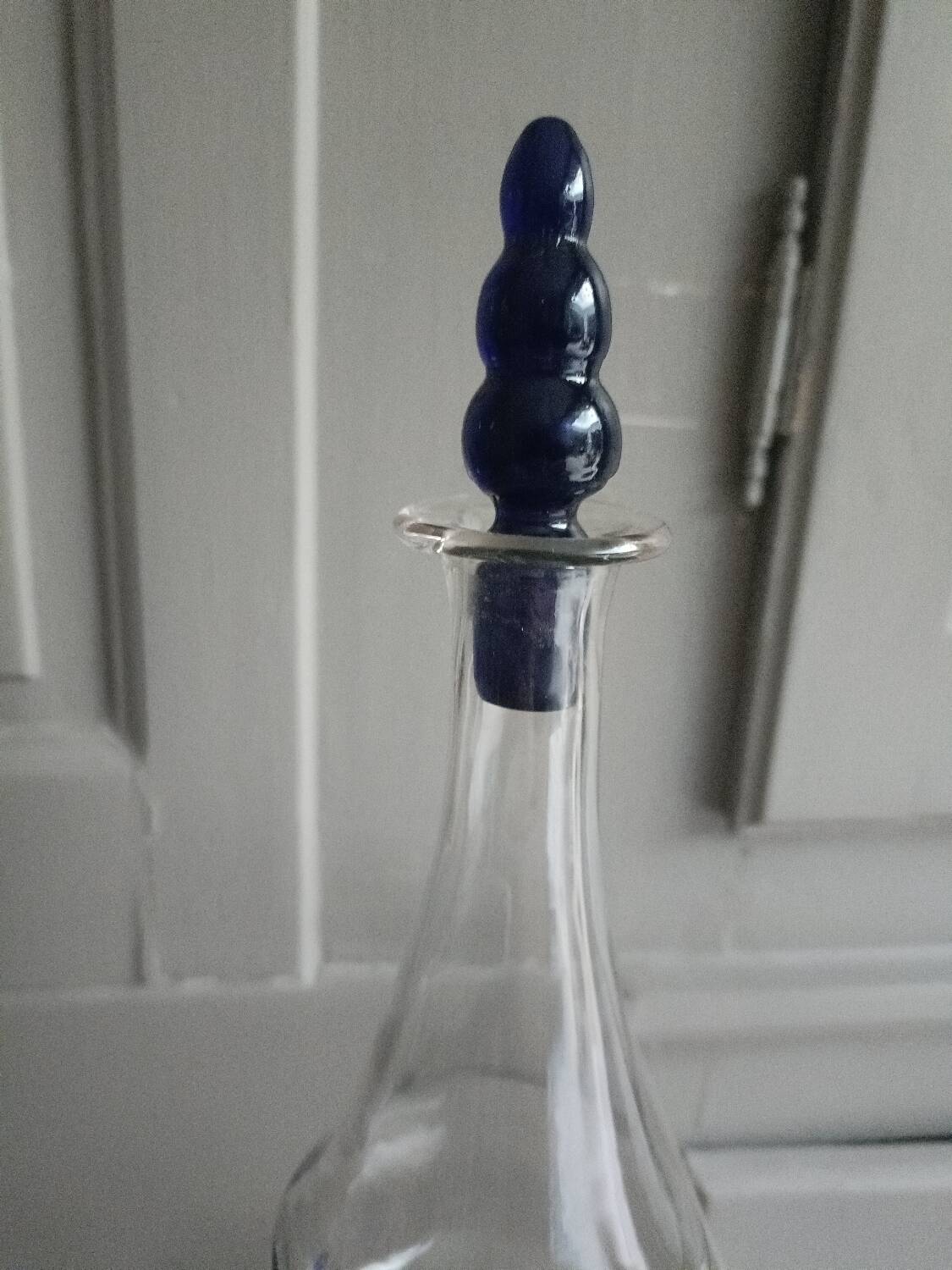 White and blue blown glass carafe