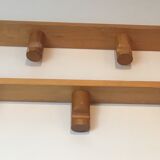 Charlotte Perriand, pair of fir wall coat racks, French work, around 1970