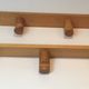 Charlotte Perriand, pair of fir wall coat racks, French work, around 1970