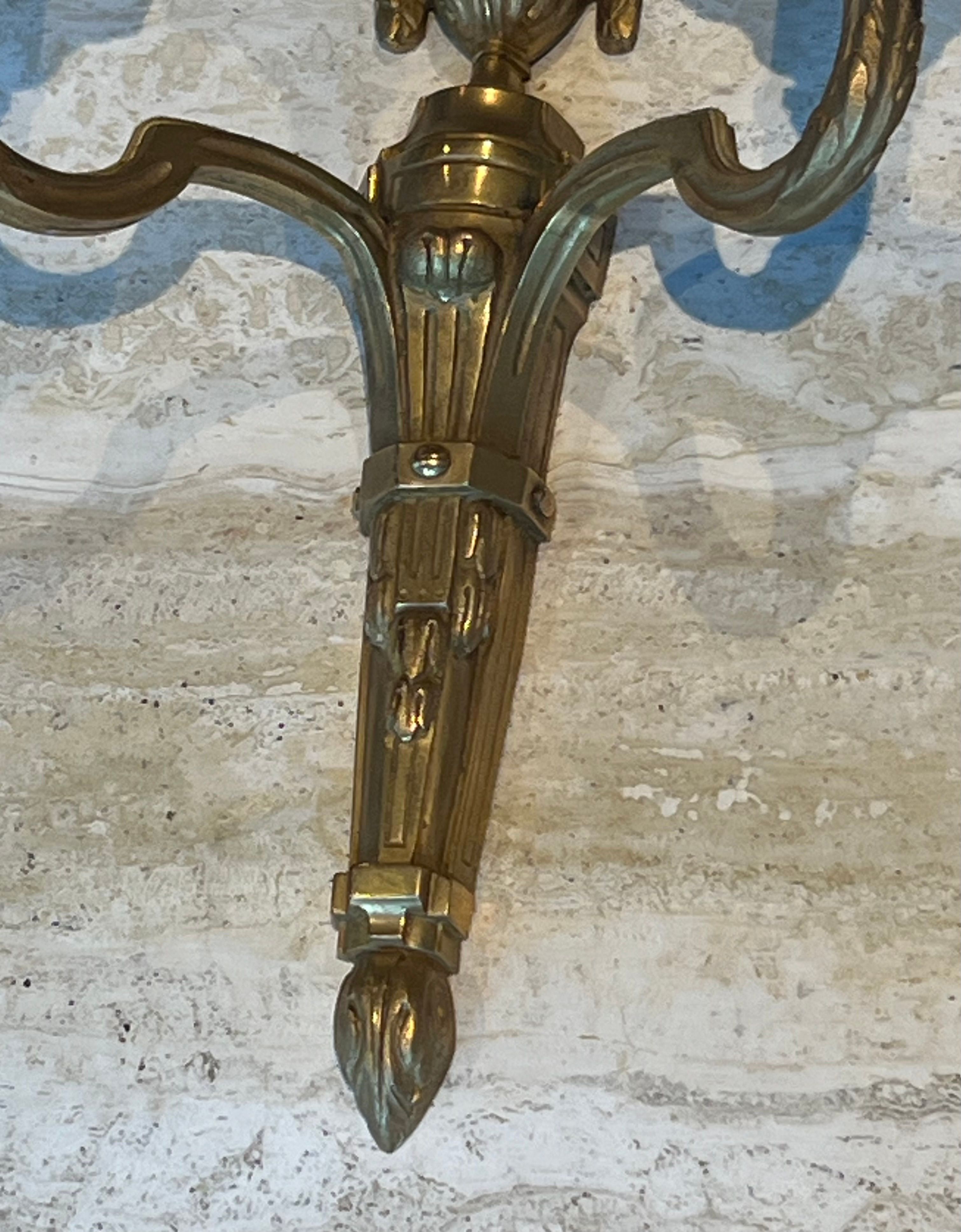 Set of 4 bronze wall lights in Louis XVI style.