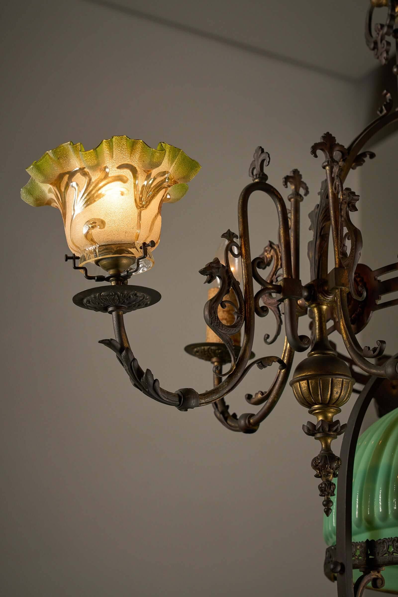 Antique adjustable height chandelier with original glasswork and brass detailing