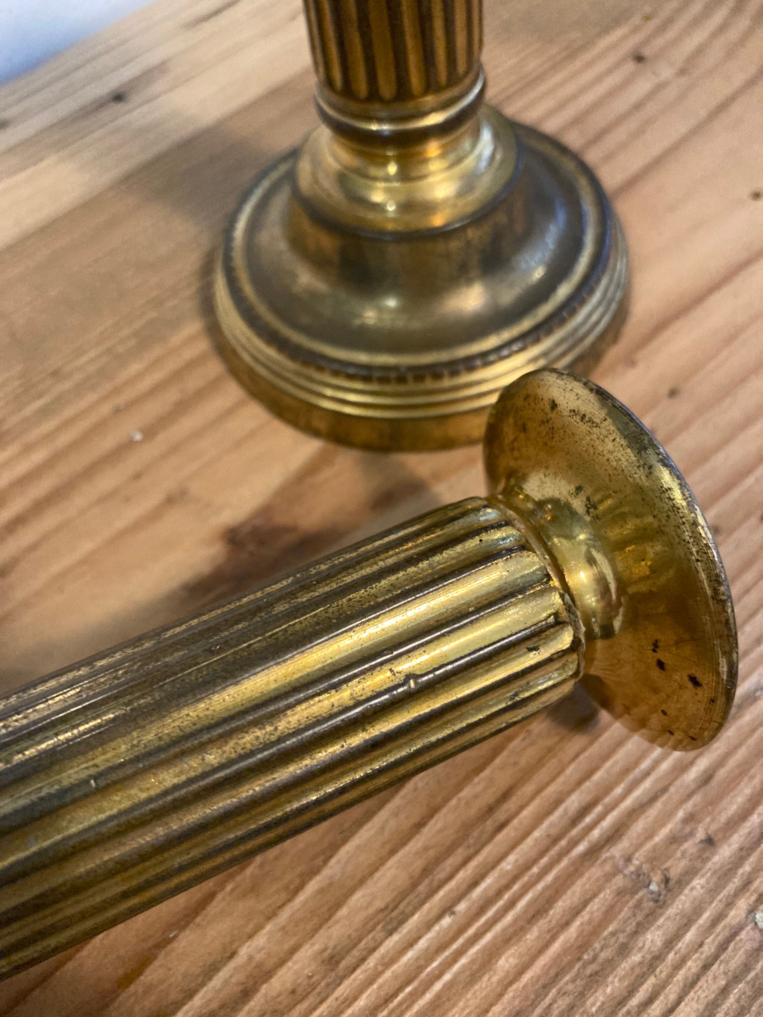 Pair of Louis XVI candlesticks in gilded bronze
