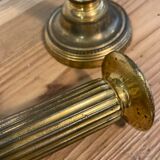 Pair of Louis XVI candlesticks in gilded bronze