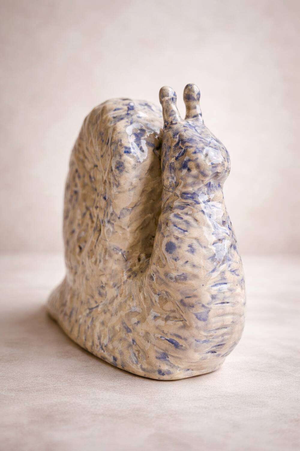 Blue and white ceramic snail