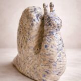 Blue and white ceramic snail