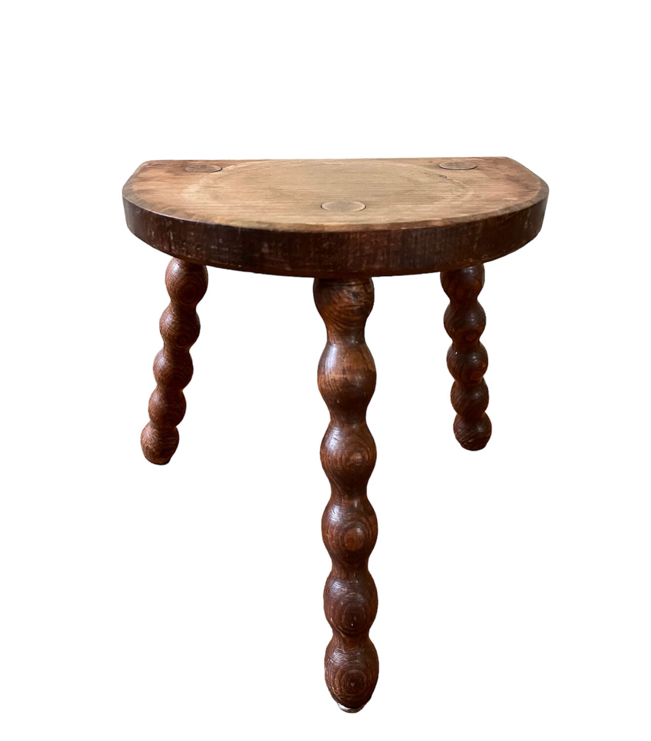 Low vintage wooden tripod stool