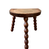 Low vintage wooden tripod stool