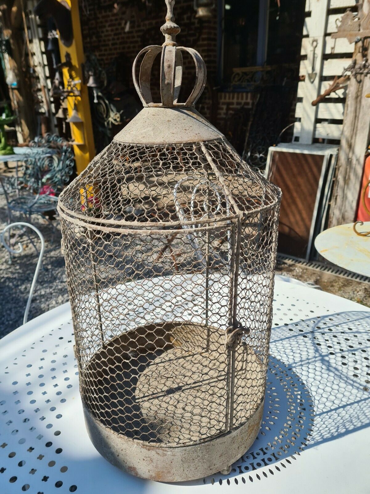iron bird cage with a crown