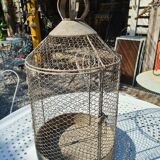 iron bird cage with a crown
