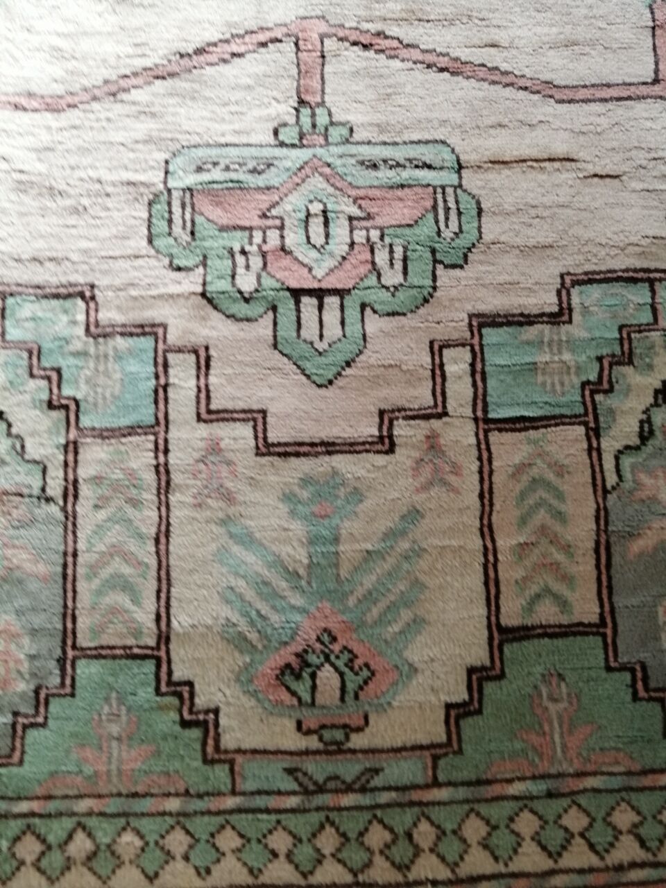 Afghan rug in pastel colors