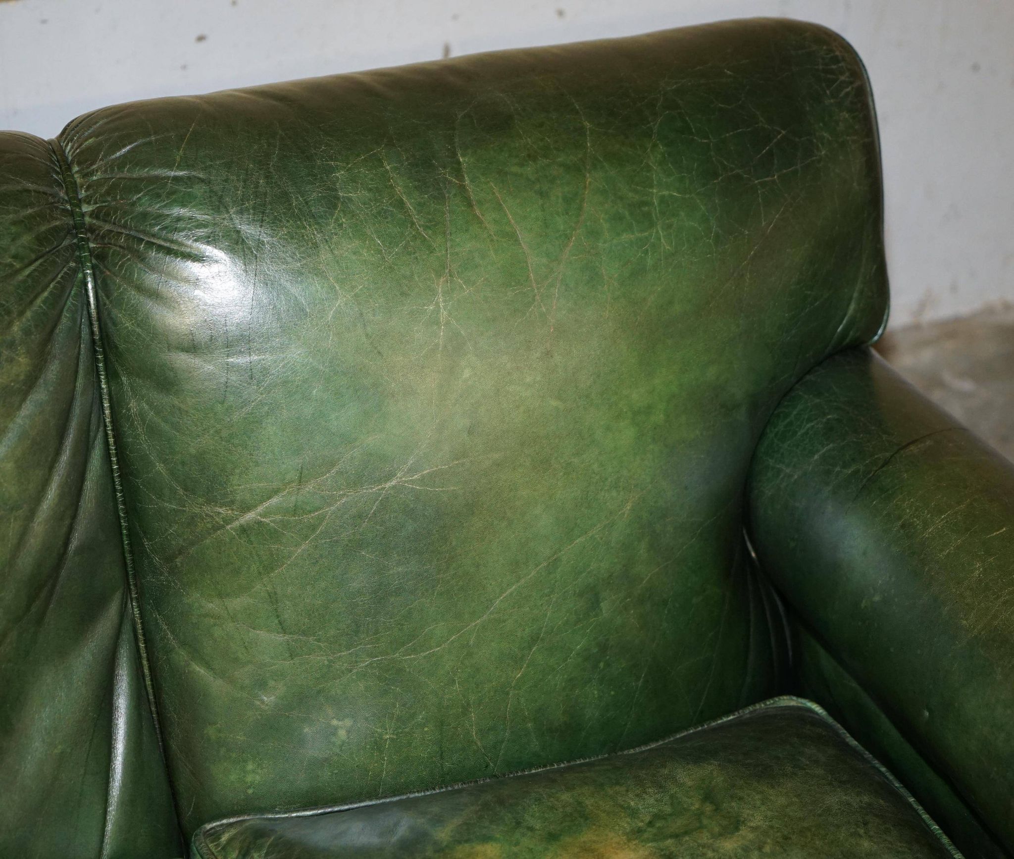 Victorian leather canapé, shield armrests, stamped Maple & Co.