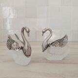 Two frosted glass swan salt cellars with silver plating.