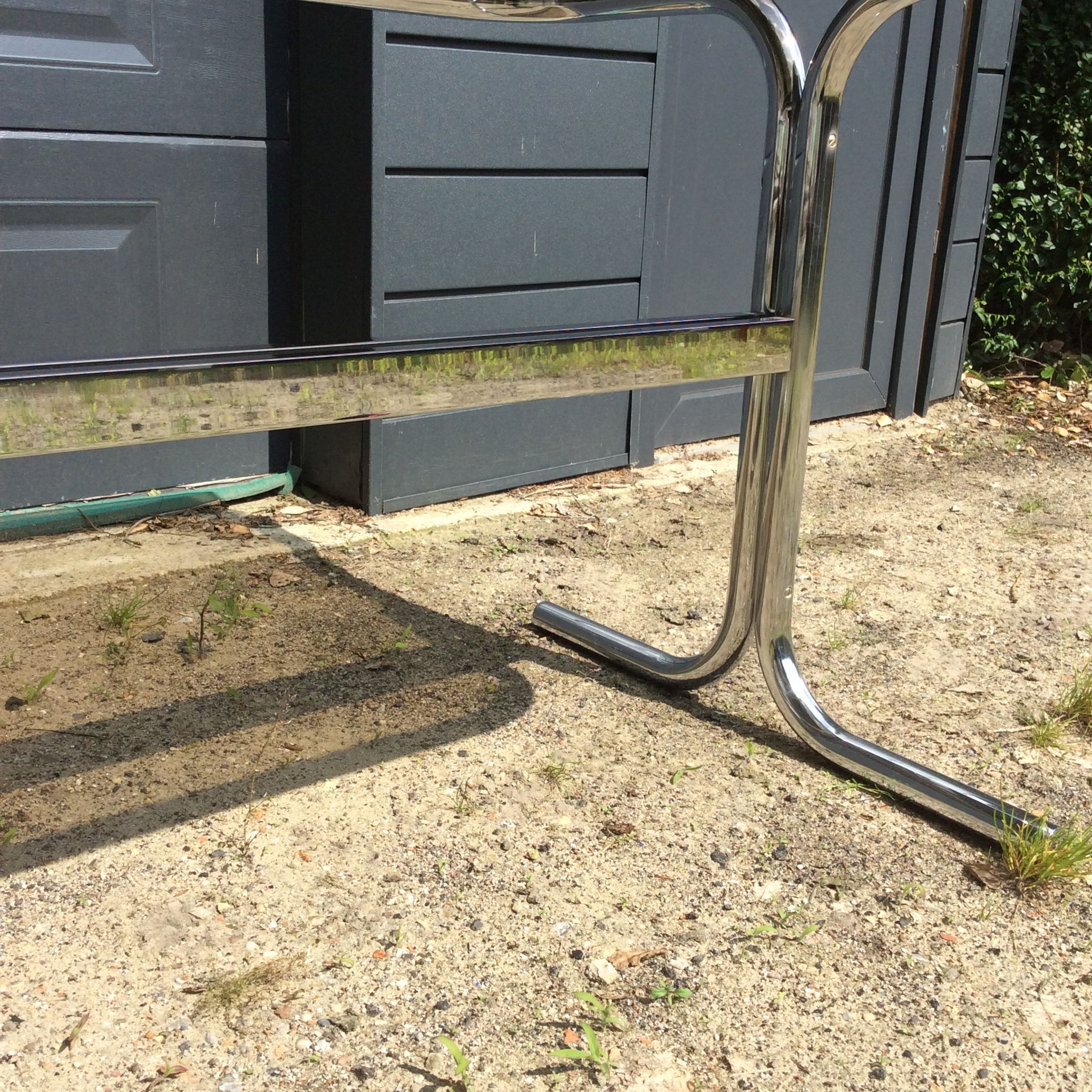 Dining table of the 70s in smoked glass and chromed metal