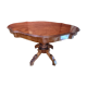 Antique mahogany table with a scalloped top and a sculpted central leg.