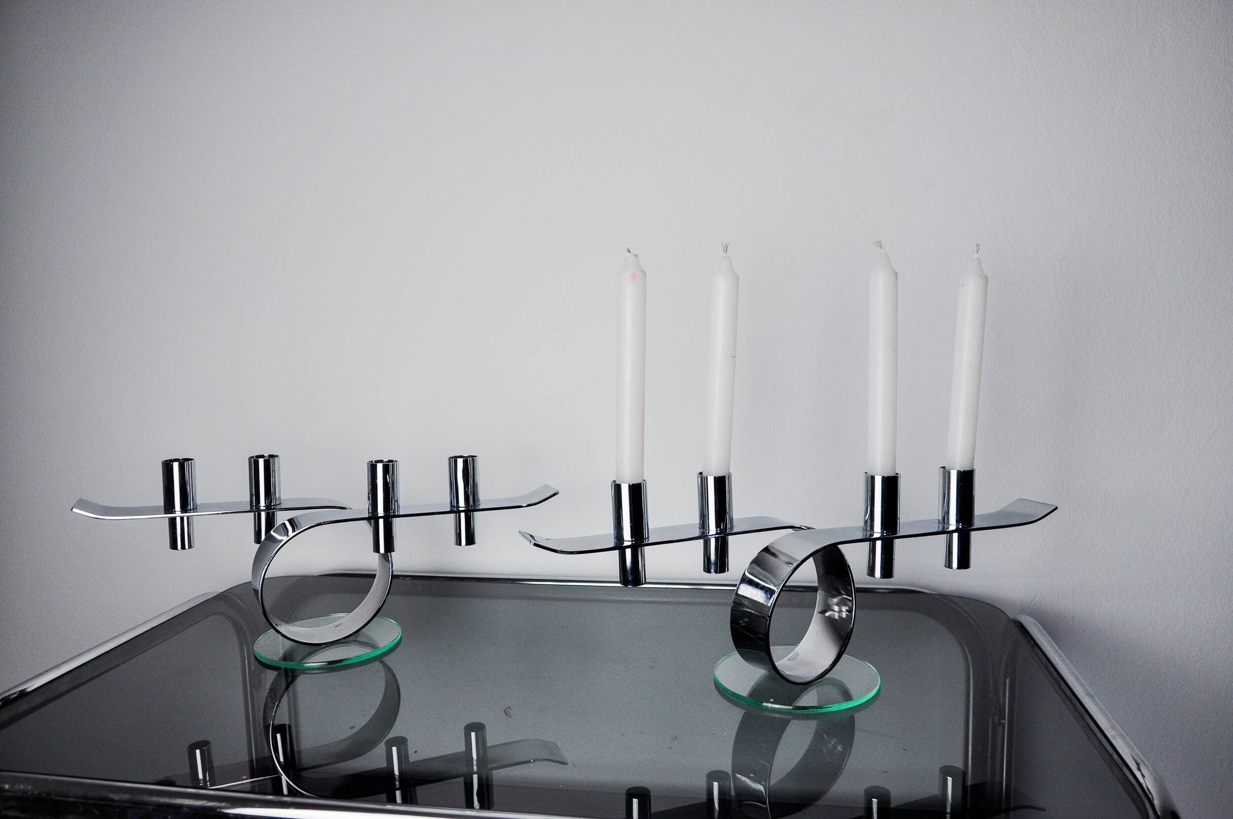 Pair of space-age 4-flame candlesticks, glass and metal, Germany, 1980