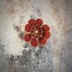 Applique murale fleur composée de pétales en rotin et lin terracotta