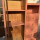 Asymmetrical vintage wardrobe painted in terracotta.