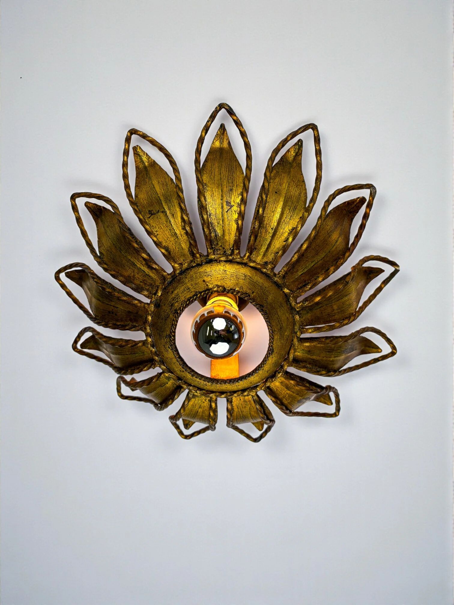 Spanish sunburst ceiling light fixture or sconce in gilt iron, circa 1960