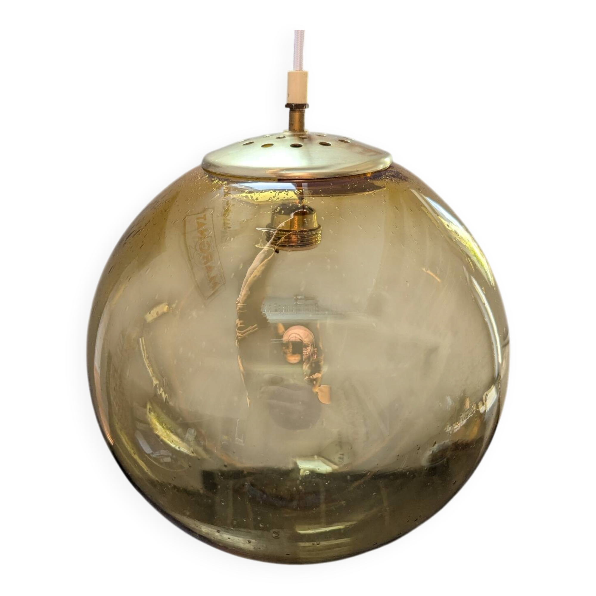 Old large and imposing thick glass globe with a bubbled amber colour, vintage.