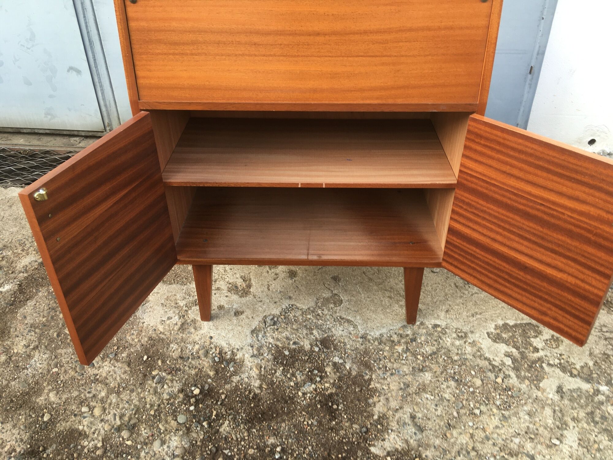 Vintage secretary with wooden compass feet with felling, shop window and closet