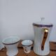Coffee pot, sugar pot, 1 cup and saucer.
