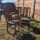 Set of 8 teak lounge chairs with high backs and zebra-striped seats